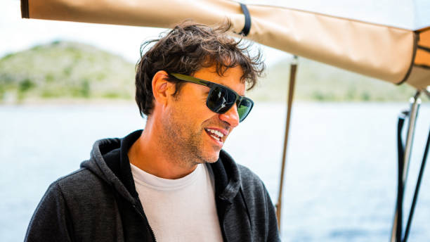 istock Crew member enjoying sailing on sailboat 1477183519