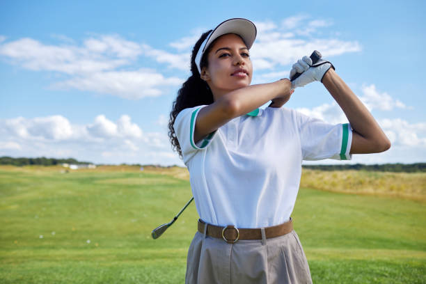 istock Black woman playing golf on field 1477183629