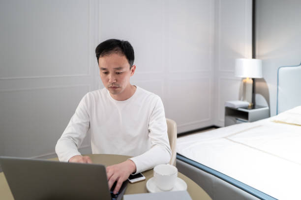 istock A business man uses a computer to work at home 1477188691