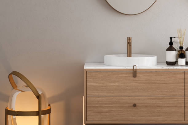 istock 3D render close up white vanity counter with ceramic washbasin and modern style faucet in a bathroom with morning sunlight and shadow. Blank space for products display mockup. Background. 1477192727