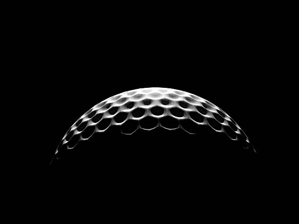 Rim lighting on two golf balls with shallow depth of field.