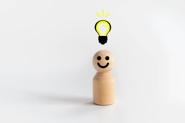istock Wooden doll Man standing with light bulb icon idea, intelligent think power, creative and idea concept. 1477196809