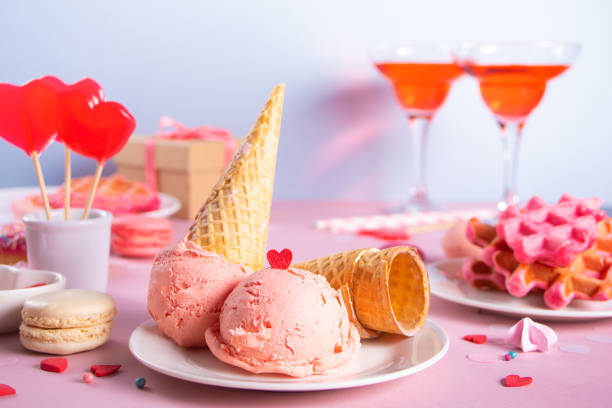 Pink ice cream cones with red sugar hearts shaped sprinkles. Valentines day concept. stock photo