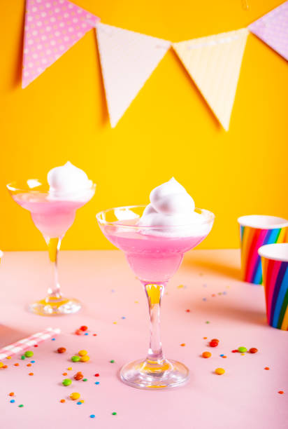 Caramel Milk shake cocktail with whipped cream and colored sweet candy cane lollipop stock photo