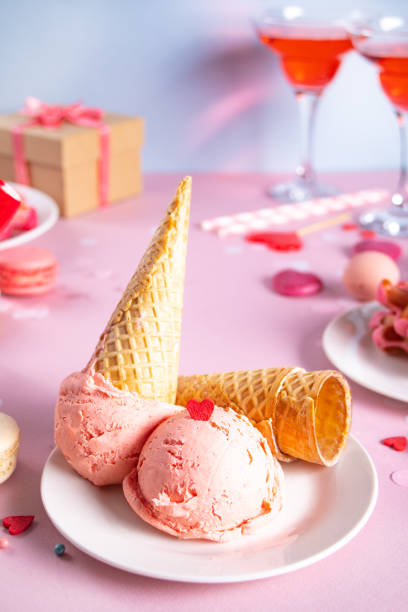 pink ice cream cones with red sugar hearts shaped sprinkles. valentines day concept. - valentines day candy chocolate candy heart shape imagens e fotografias de stock