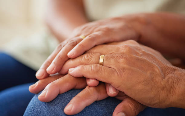 istock Couple holding hands for support and love, gratitude for help and support and kindness in retirement in home. Elderly friends or senior people with respect, community and hope in marriage 1477199462