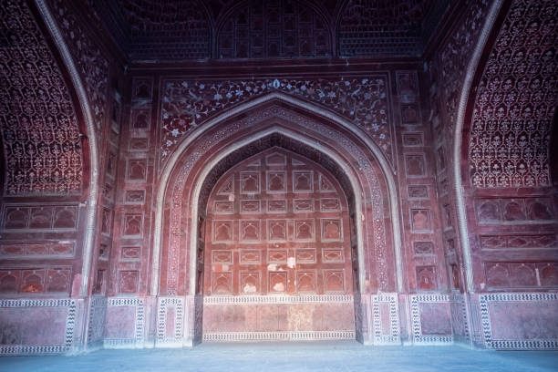Agra, India - March 2019: A beautiful ornate arch at the old Mughal era mosque in the Taj Mahal complex.