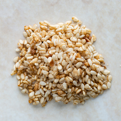 Selective focus on homemade whole wheat dough on kitchen table with ingredients, close up