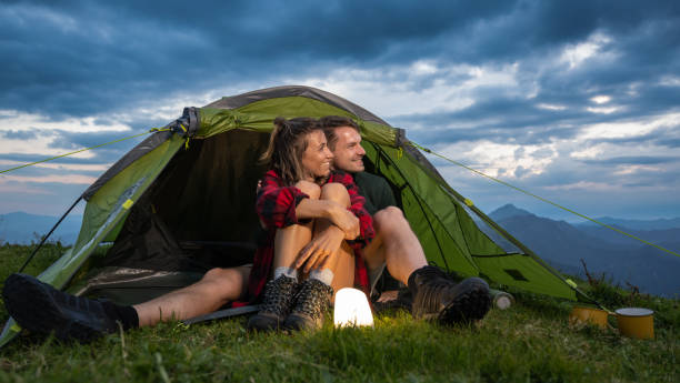 istock Couple Camping In The Mountains 1477209353