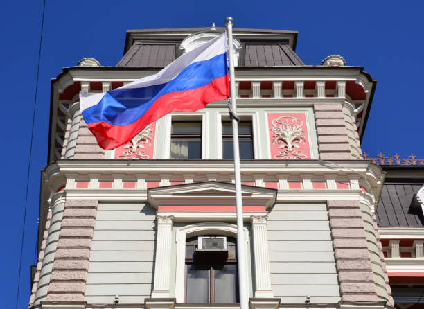 national red, blue, white flag state Russian Federation on silk on facade building Consulate General Russia, concept of travel, immigration, politics, international relations