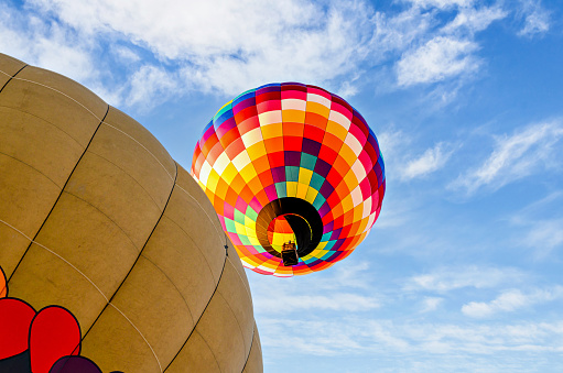 The top of a hot air balloon that is almost full and ready for lift off.