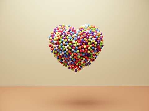 Multi colored balls with the shape of heart symbol. (3d render)