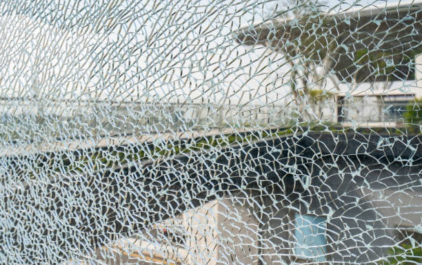 istock background of cracked window,Broken glass wall. 1477212691