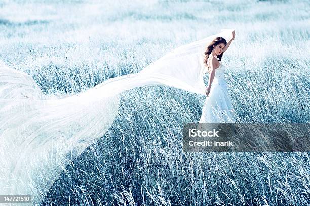 Bride In Blue Field With Waving Fabric Stock Photo - Download Image Now - Dress, One Woman Only, Side View