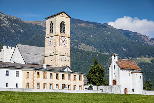 Abbey monastery in Val Müstair village, Alpine Landscape in Inn Valley, Graubunden, Swiss Alps