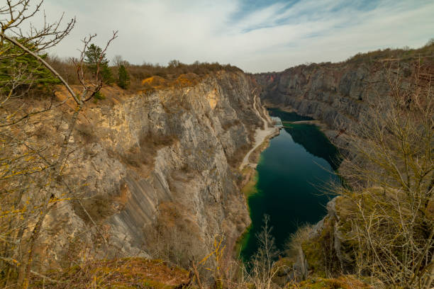 Old quarry Velka Amerika in spring cloudy hot day stock photo