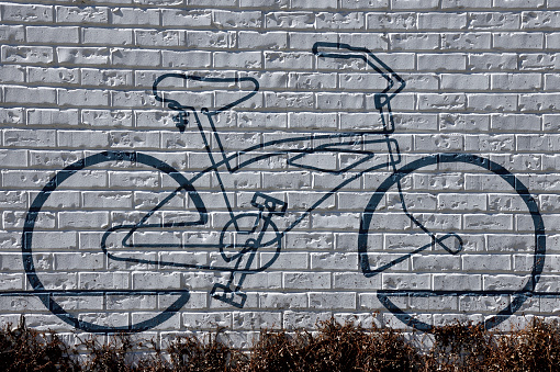 Bicycle wall mural drawing at wall background.