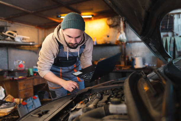 istock Mechanic working on a car in the garage 1477216531