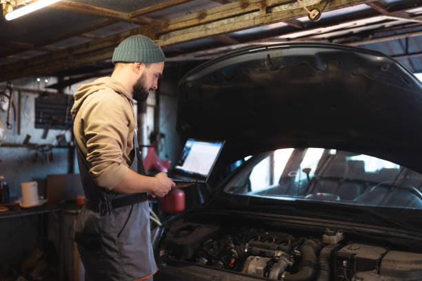 istock Mechanic working on a car in the garage 1477216535
