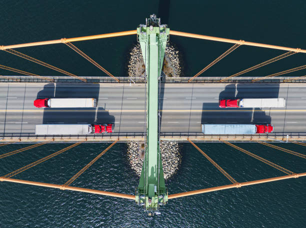 istock Semi Trucks Crossing Bridge 1477217179