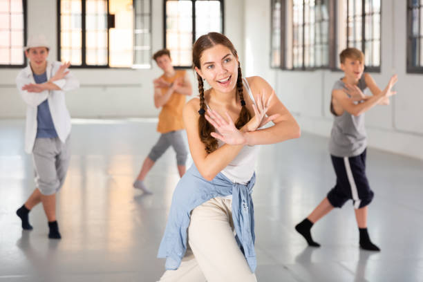 istock Group teenagers dancing hip-hop indoors 1477219598