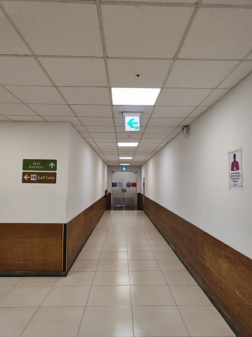 Staff only mall corridor in Indonesia with sign that says \