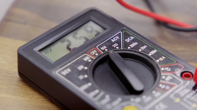 digital multimeter with screen on. Measurement of voltage or current.