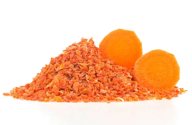 Photo of Chopped dried carrot and fresh carrot slices isolated on a white background