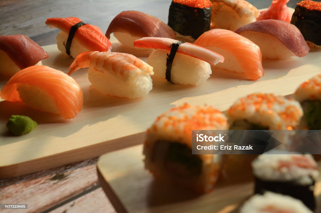 Set of Nigiri Sushi and Hand Rolled Sushi Detail Shot of Nigiri Sushi, Hand Rolled Sushi, Tuna Maki Art Stock Photo