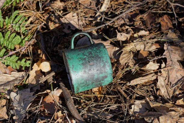 istock one old dirty metal enameled black green mug 1477227043