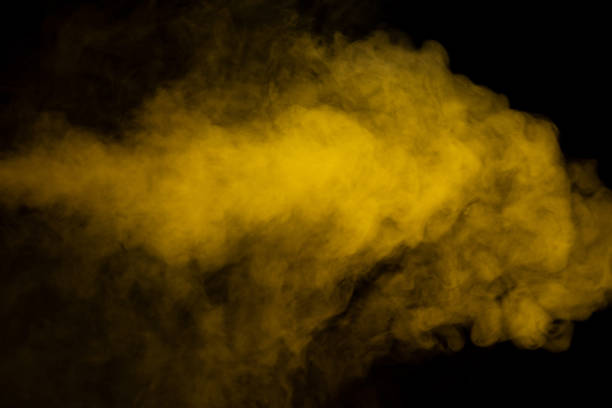 istock Yellow steam on a black background. 1477227370