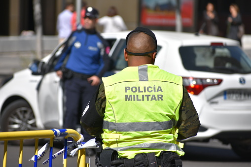 Madrid's Patriotic Military Police Force Officer Patrolling the Streets in Hi-Vis yellow vest