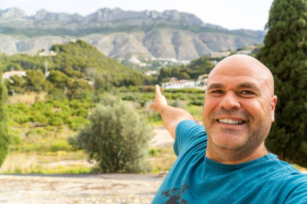 istock A man taking a selfie smiling outdoors 1477230356