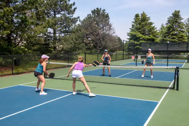 Photo of Pickleball Players in Action at Net