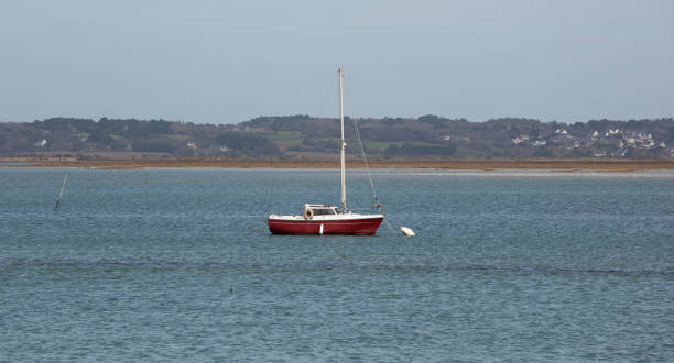 istock A sailboat at anchor alone in the calm bay. 1477230705