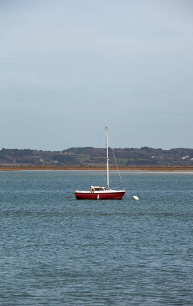 istock A sailboat at anchor alone in the calm bay. 1477230731