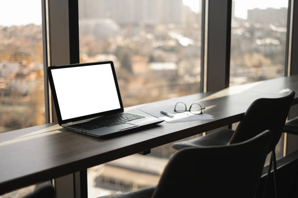 istock laptop on table with sea view freelancer workplace in coworking space mockup 1477231166