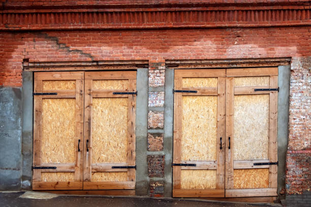 istock Time gate made of chipboard in an old brick building 1477231918