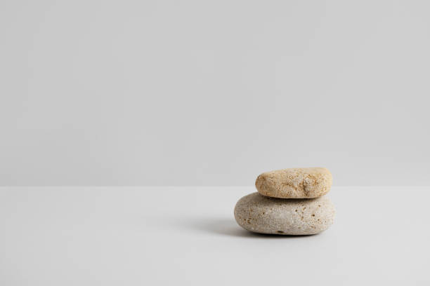 istock Empty stone podium on light grey background. Minimal eco backdrop. Round balanced rocks pedestal. Abstract showcase for product presentation. Wabi sabi concept. Natural still life. Copy space 1477233440