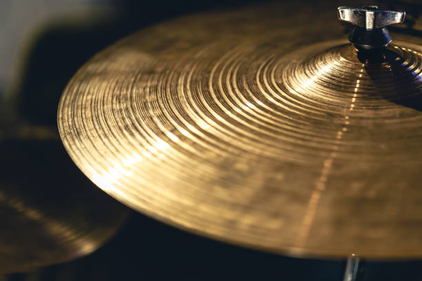 istock Drum cymbal close-up on a dark background. 1477239297