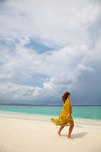istock Young woman relaxing on beach 147723966