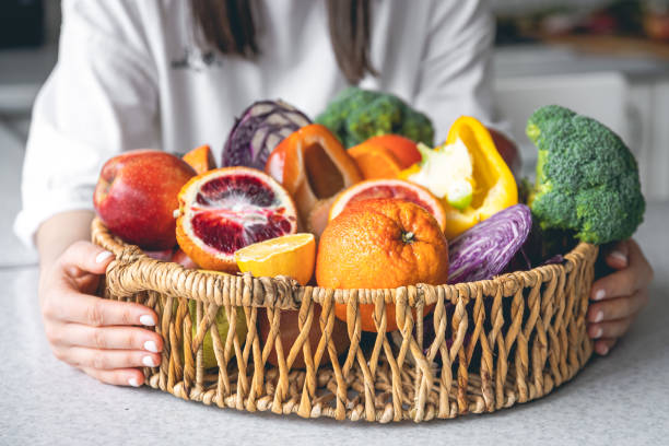 istock Big basket with fruits and vegetables, close-up. 1477241211