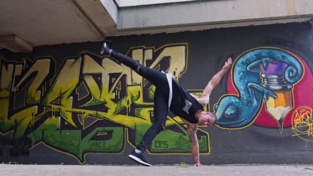 Young man performing breakdance tricks