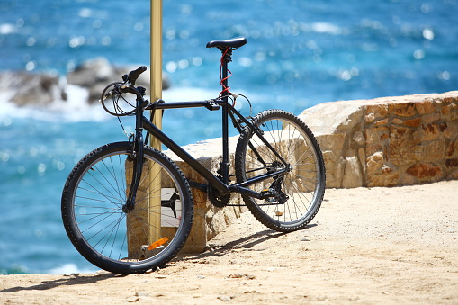 bicycle on the background of the blue sea on a hot sunny day, travel tourism concept