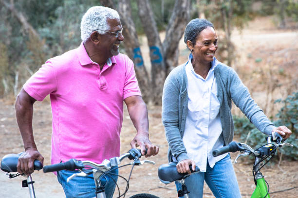 istock Senior African American Couple Riding Bikes 1477248015