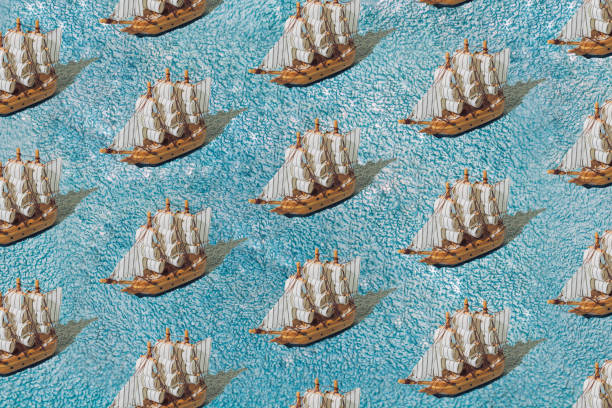 istock A wooden sailing ship on a blue towel. Pattern. 1477250802