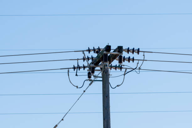 istock Overhead electricity supply transmission posts in rural areas. 1477251886