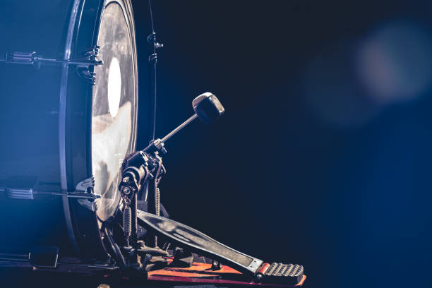istock Bass drum with pedal, musical instrument on black background. 1477253116