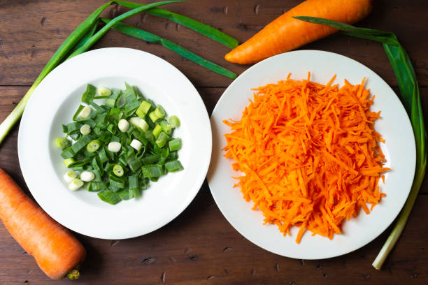 istock Chopped chives and grated carrot 1477253445