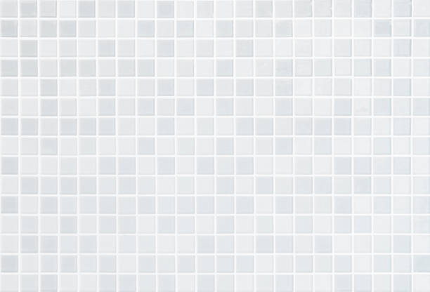 istock White tile wall chequered background bathroom floor texture. Ceramic wall and floor tiles mosaic background in bathroom and kitchen clean. Design pattern geometric with grid wallpaper decoration pool. 1477253523